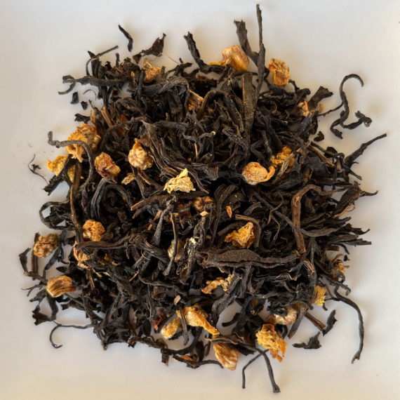 dry chyrsanthemum black tea on a white plate